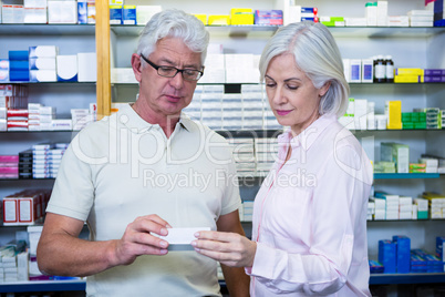 Customers checking medicines