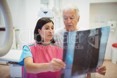 Female doctor discussing x-ray with patient