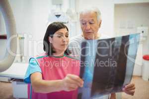Female doctor discussing x-ray with patient