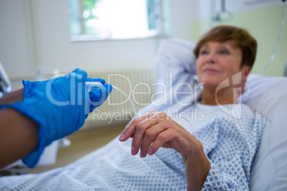 Nurse giving an injection to a patient