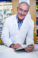Pharmacist using a digital tablet