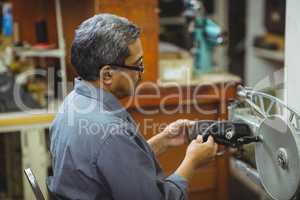 Shoemaker using sewing machine