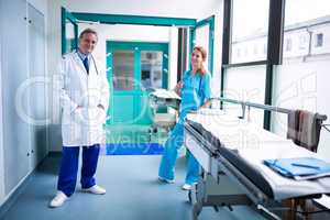 Portrait of doctor and surgeon standing in surgical room