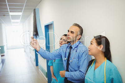 Doctor and nurses looking at x-ray