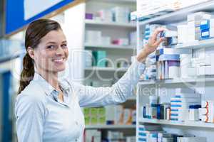 Pharmacist checking a medicine in pharmacy