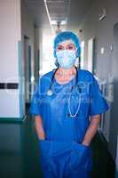 Portrait of surgeon standing with hand in pocket