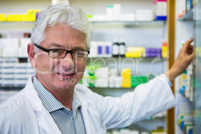 Pharmacist checking medicines in pharmacy