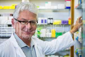 Pharmacist checking medicines in pharmacy