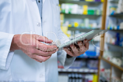 Pharmacist using a digital tablet