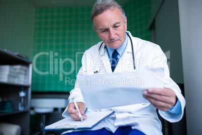 Doctor checking medical report