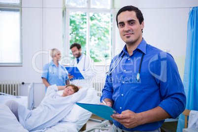 Smiling doctor holding a medical report