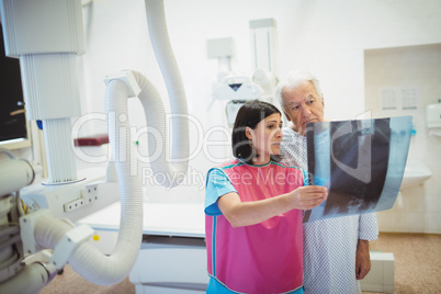 Female doctor discussing x-ray with patient