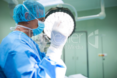 Surgeon standing in operation room