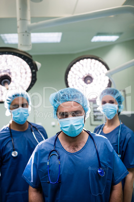 Portrait of surgeons standing in operation room