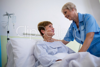 Nurse talking to a senior patient