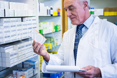 Pharmacist checking medicines