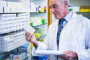 Pharmacist checking medicines