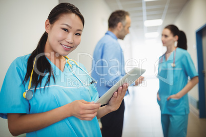 Nurse holding digital tablet in hospital