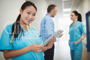 Nurse holding digital tablet in hospital