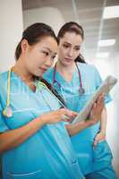 Nurses using digital tablet