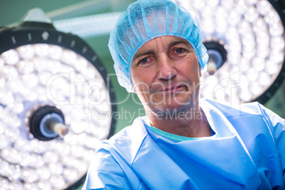 Portrait of surgeon standing in operation room