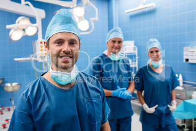 Portrait of surgeons smiling in operation room