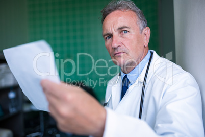 Doctor holding a report