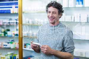 Customer holding a medicine box in pharmacy