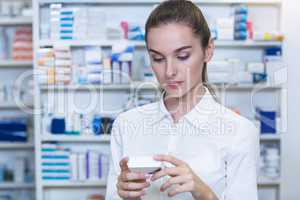 Pharmacist checking a medicine box