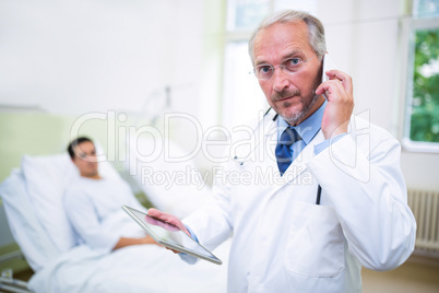 Doctor talking on mobile phone