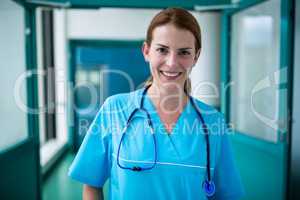 Portrait of surgeon standing in corridor