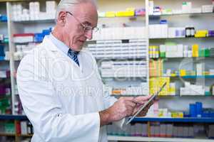 Pharmacist using a digital tablet