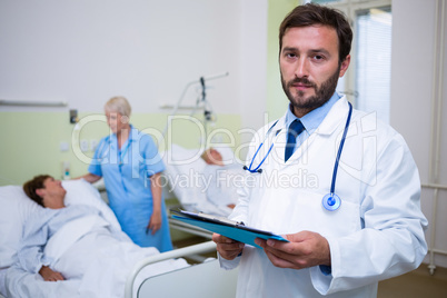 Portrait of doctor checking a medical report