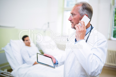 Doctor talking on mobile phone