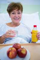 Portrait of smiling patient having a breakfast