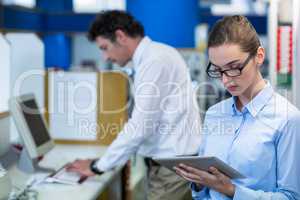 Pharmacist using digital tablet