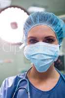 Portrait of surgeon wearing surgical mask in operation room