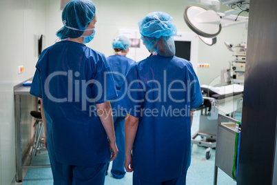 Surgeons walking in operation room