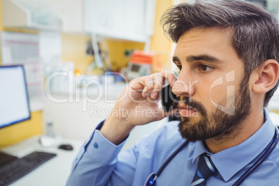 Doctor talking on mobile phone