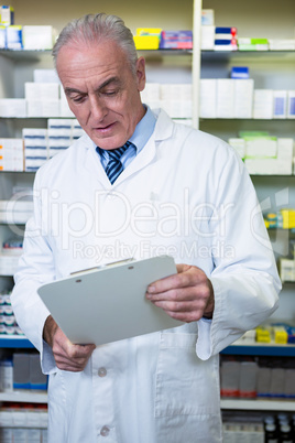 Pharmacist reading a prescription