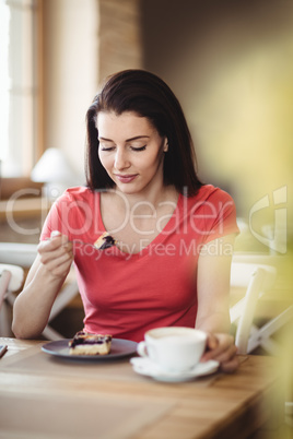 Woman having a slice of cake