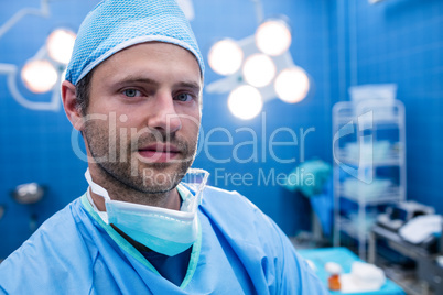 Portrait of surgeon standing in operation room