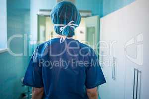 Surgeon standing in corridor at hospital