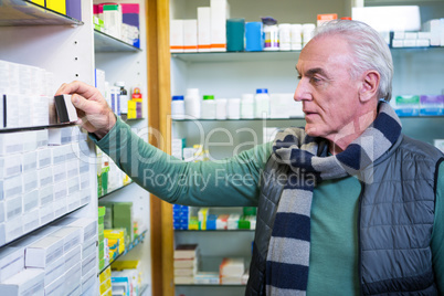 Customer checking a pill box