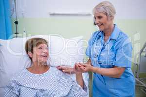 Nurse talking to a senior patient