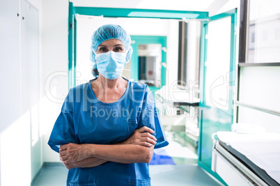 Surgeon standing in corridor at hospital