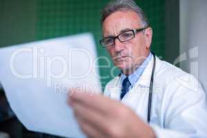 Doctor examining a report