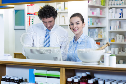 Pharmacists working at counter