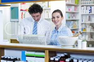 Pharmacists working at counter