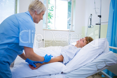 Nurse giving an injection to a patient